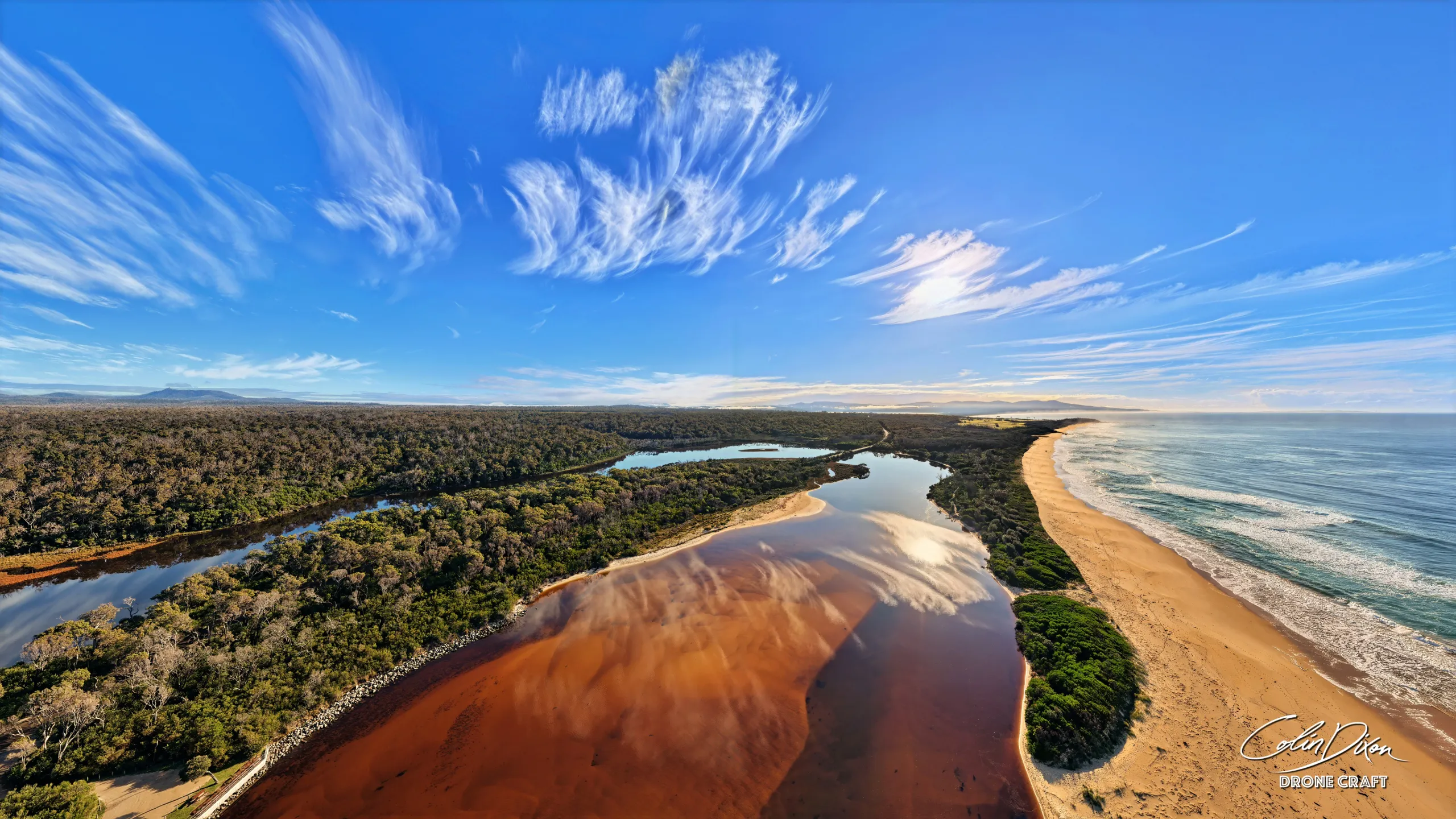 The Betka River meeting the sea on the Wilderness Coast, photographed from the air by Colin Dixon